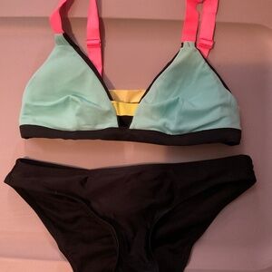 Bikini small bright multi colored top with black bottoms. W20